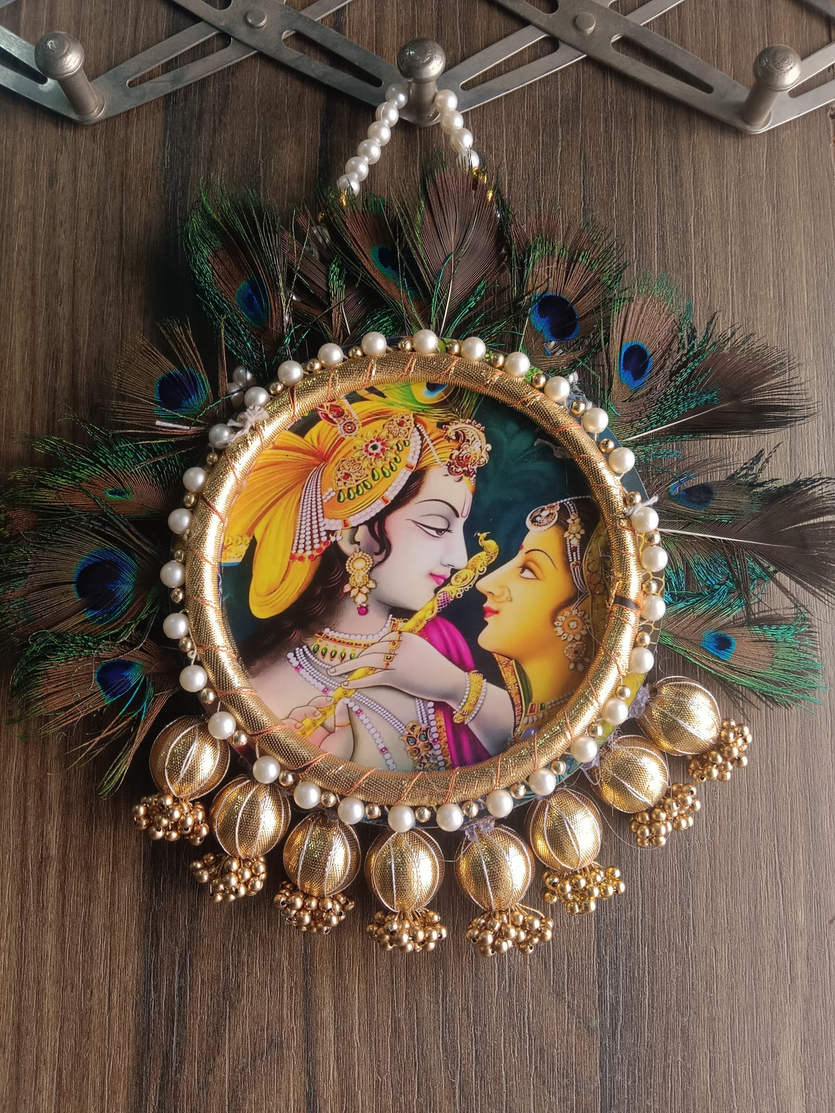 Nutts Radha Krishna Peacock Feather Wall Hanging for Home Décor | Handmade Pearl & Golden Decorative Hanging for Pooja Room, Entrance & Festive Decoration Pack of 1 (SMALL108)