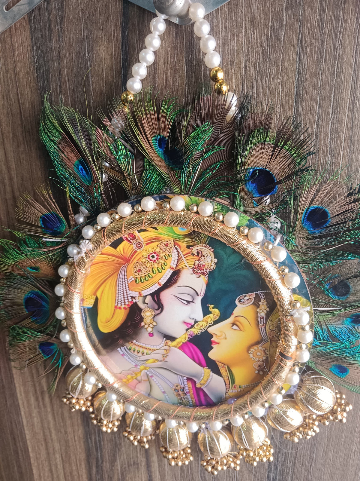 Nutts Radha Krishna Peacock Feather Wall Hanging for Home Décor | Handmade Pearl & Golden Decorative Hanging for Pooja Room, Entrance & Festive Decoration Pack of 1 (SMALL108)