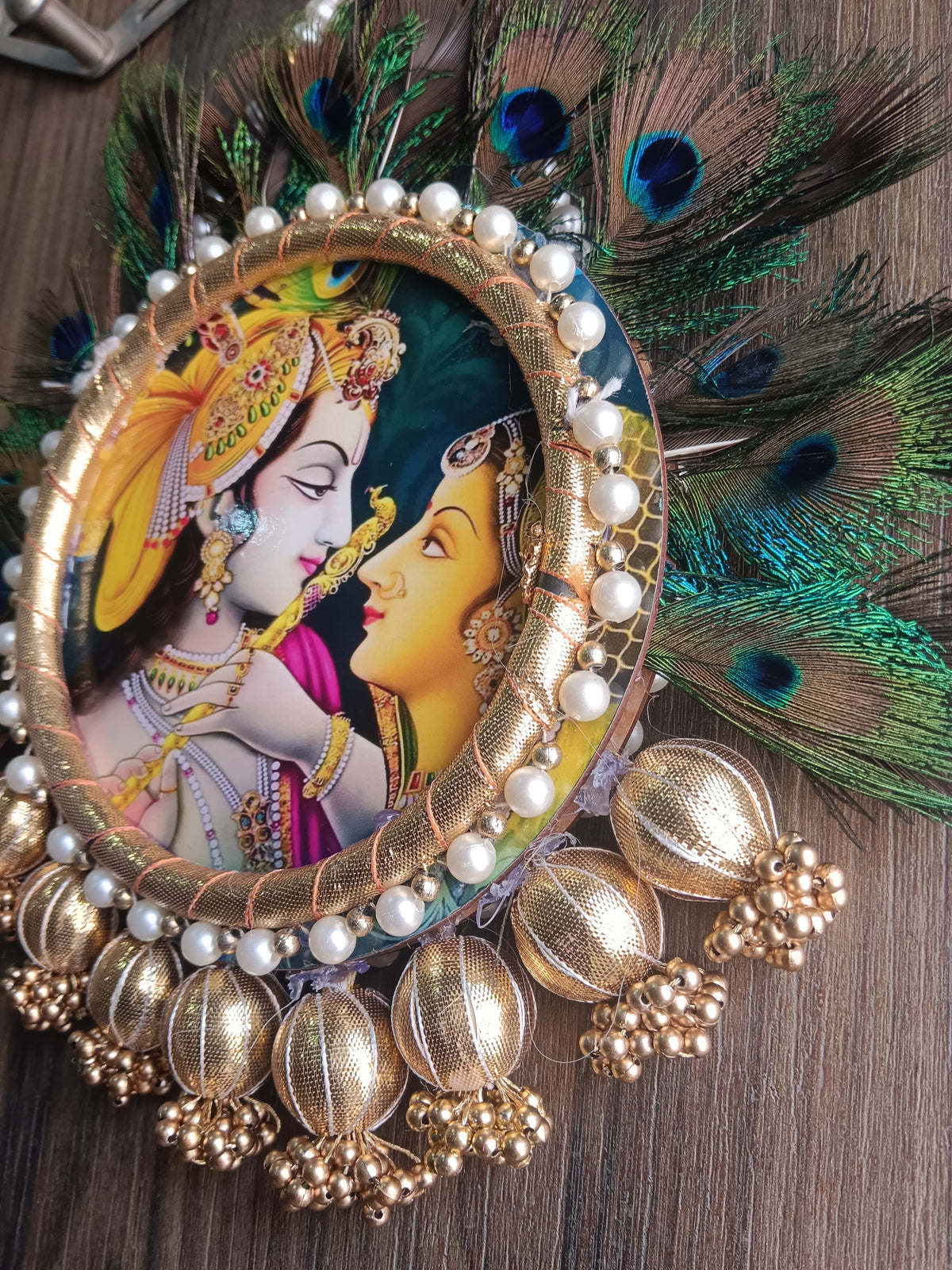 Nutts Radha Krishna Peacock Feather Wall Hanging for Home Décor | Handmade Pearl & Golden Decorative Hanging for Pooja Room, Entrance & Festive Decoration Pack of 1 (SMALL108)